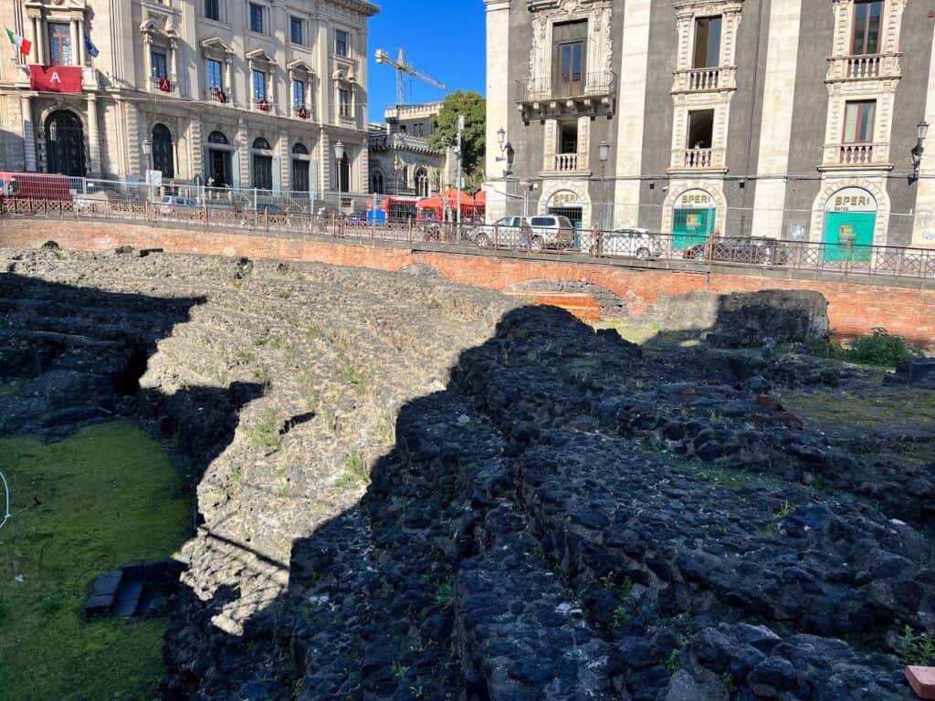 The Roman Amphitheater of Catania sits between two of the busiest streets in Catania