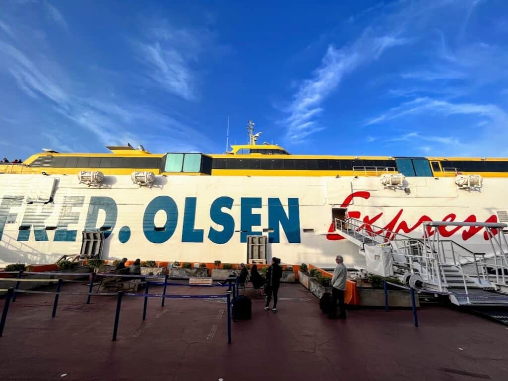 A Fred Olsen Express ferry is parked at port, which is the company we recommend for how to get to La Palma 
