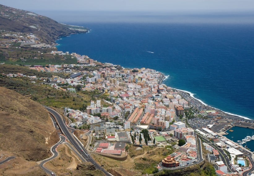 Breathtaking panoramic view from Mirador de la Concepción overlooking the vibrant cityscape of Santa Cruz de la Palma, Canary Islands, with the azure Atlantic Ocean hugging the coast, a must-visit for anyone compiling their list of things to do in Santa Cruz de la Palma.