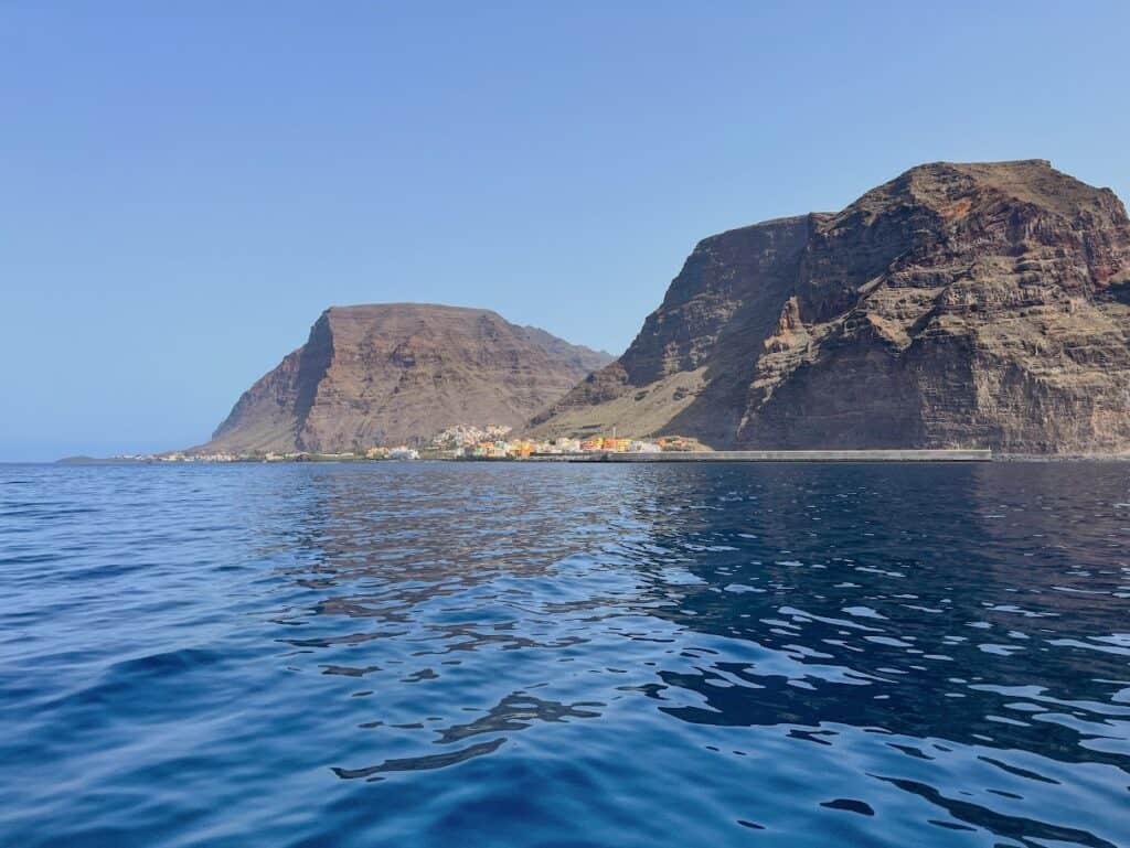 Valley Gran Rey is viewed from the ocean with two mountains on either side