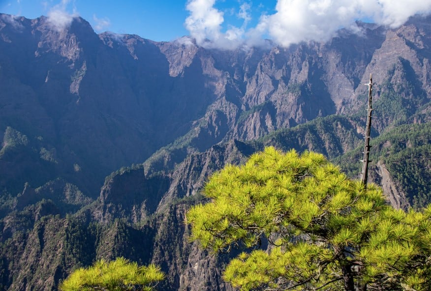View from Mirador Astronómico del Llano del Jable in La Palma, featuring rugged peaks and lush greenery, makes one ponder Is La Palma worth visiting?