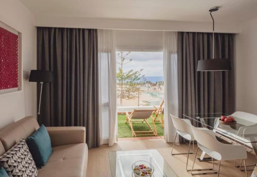 Modern living room with a view of the ocean from the balcony at Flamingo Beach Mate, one of the best moderate hotels in Costa Adeje.