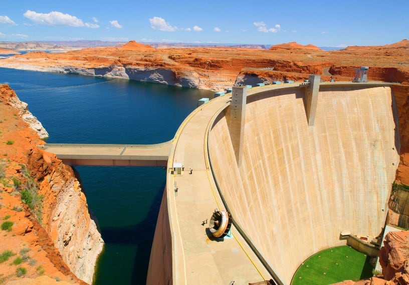 The impressive Glen Canyon Dam, showcasing the engineering marvel and scenic beauty along the route from the Grand Canyon South Rim to Page, Arizona.
