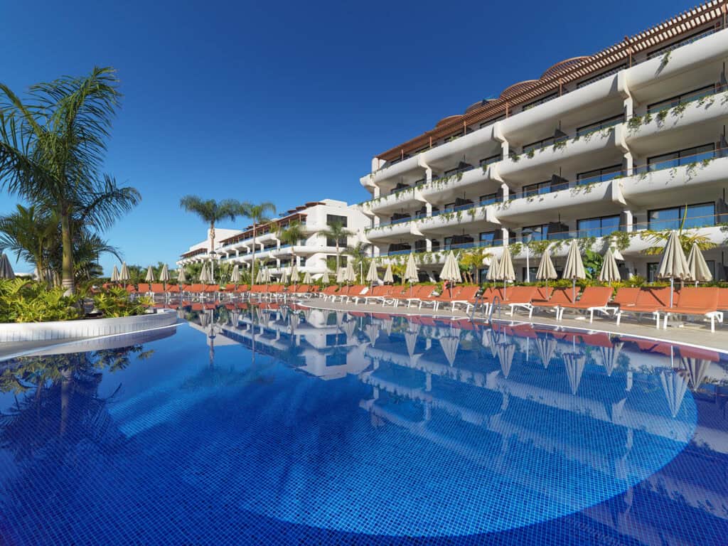The expansive family pool area at H10 Atlantic Sunset, one of the best family-friendly hotels in South Tenerife.