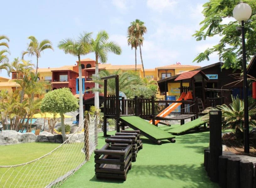 This vibrant resort features colorful buildings, lush greenery, and a fun playground for kids, making it one of the best hotels in Los Cristianos all inclusive for families.