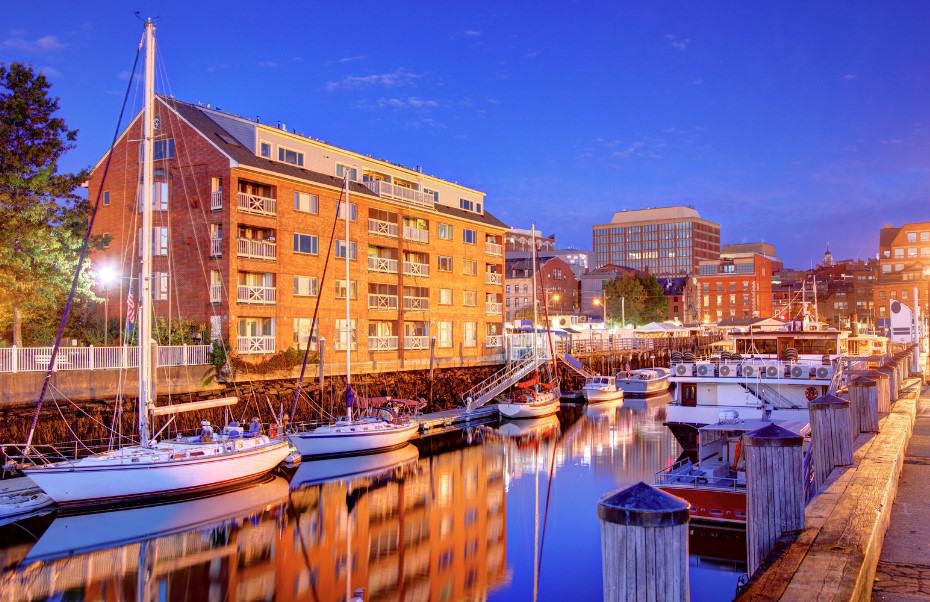 The vibrant waterfront of Portland at night, showcasing a lively scene for a perfect weekend in Portland, Maine.
