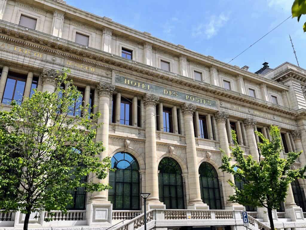 The historic Hotel des Postes building in Geneva, Switzerland, showcasing its grand architecture with columns and intricate details. Perfect for a two days in Geneva itinerary to explore significant landmarks.