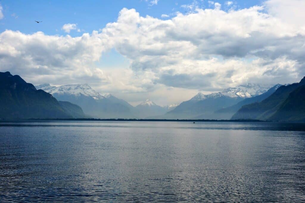 Peaceful mountain views from Vevey with misty peaks and a calm lake, showcasing the natural beauty and tranquility of Lake Geneva Switzerland things to do outdoors.
