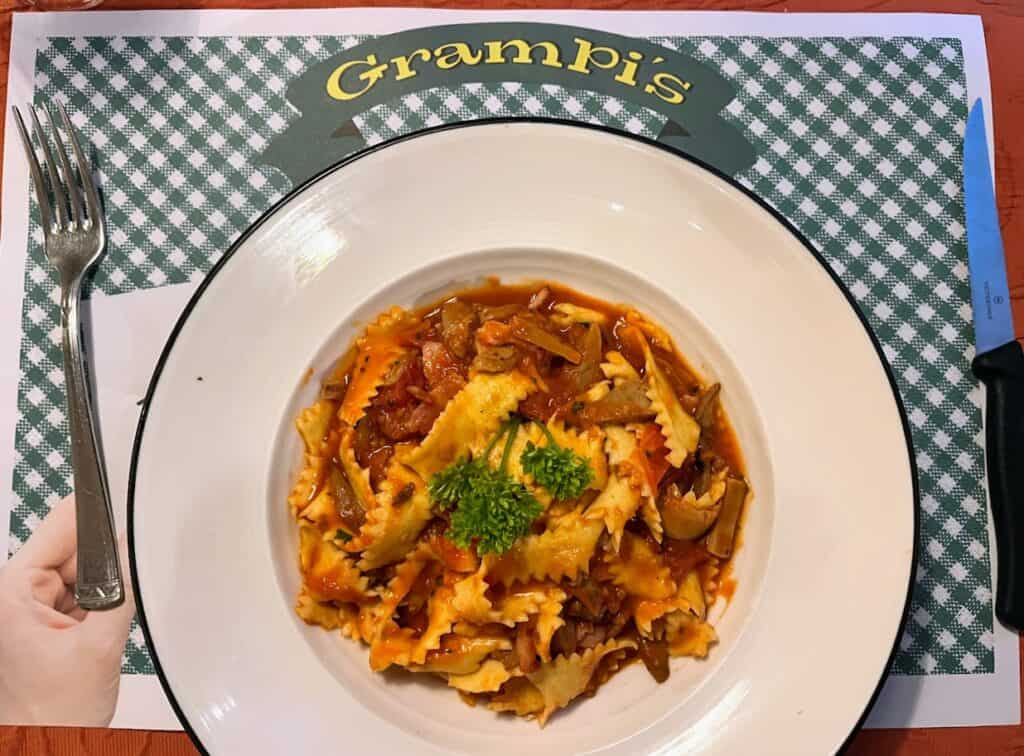 A delicious pasta dish served at Grampi’s Bar & Restaurant features vibrant colors, with rich red sauce and fresh herbs atop the perfectly cooked noodles. 